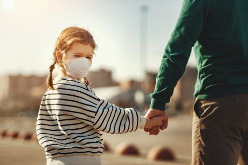 Little girl in medical mask
