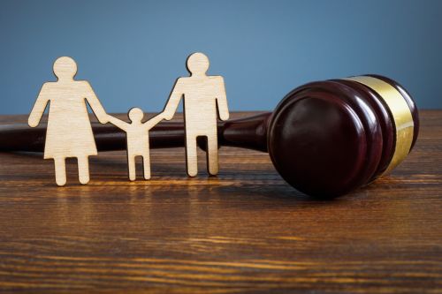 Family law concept. Figures and gavel.